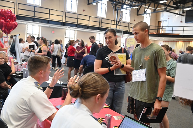 A matriculating student and his family speak with VMI cadets at the 2025 Matriculation Fair during the first day on post for freshmen.