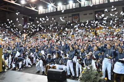 After being relieved of duty, the Class of 2026 rejoices with cheers and the traditional tossing of their gloves. –VMI Photo by H. Lockwood McLaughlin.