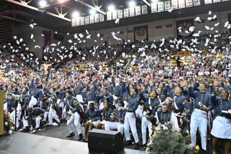 After being relieved of duty, the Class of 2026 rejoices with cheers and the traditional tossing of their gloves. –VMI Photo by H. Lockwood McLaughlin.