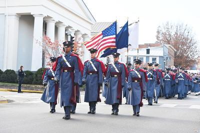 Members of the Corps of Cadets march down Main Street.