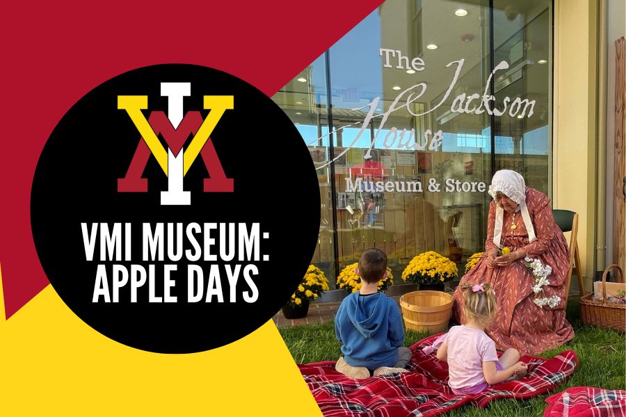 Museum interpreter Tamara Teaff shares the tale of “The Conceited Apple Blossom” with children on Apple Day.