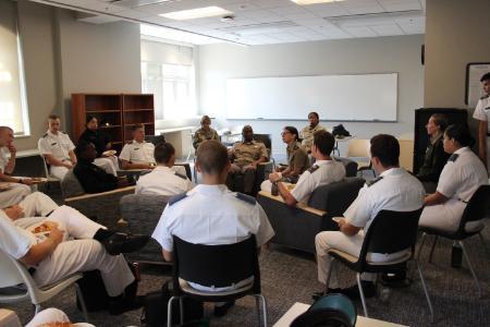 Cadets, faculty and staff in an informal conversational setting
