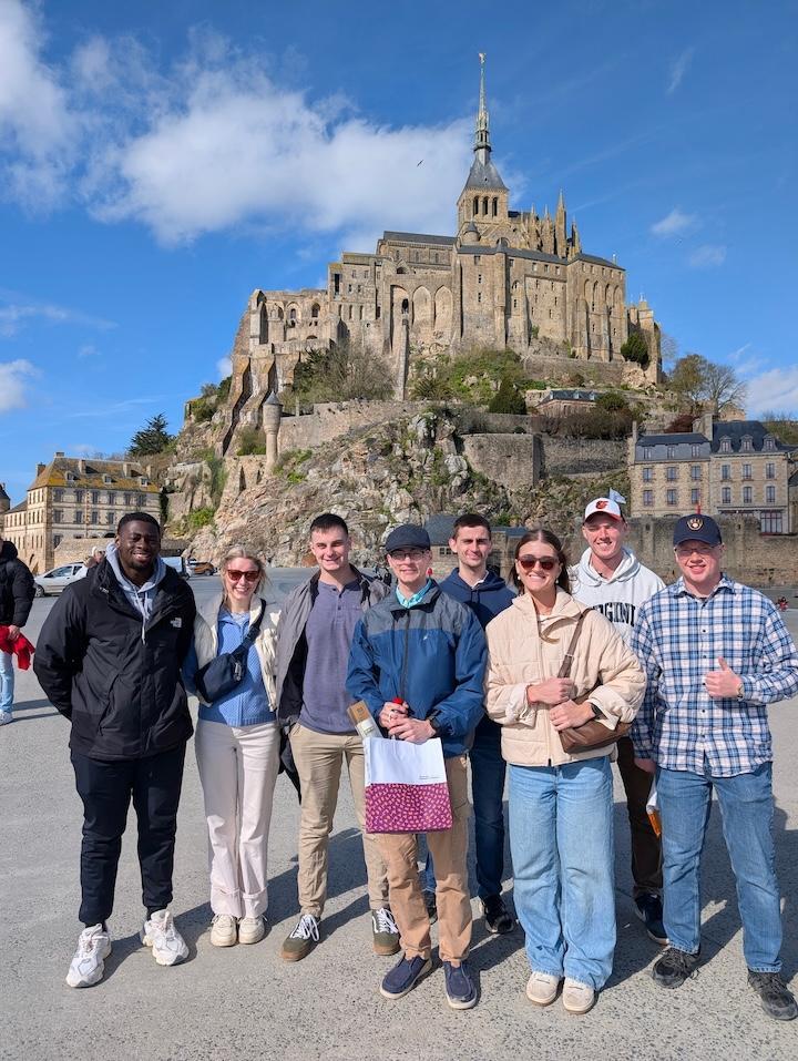 Mont Saint-Michel towers over VMI cadets in Normandy, France.