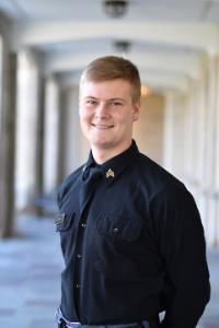 A picture of Jacob Parrish in front of Moody Hall