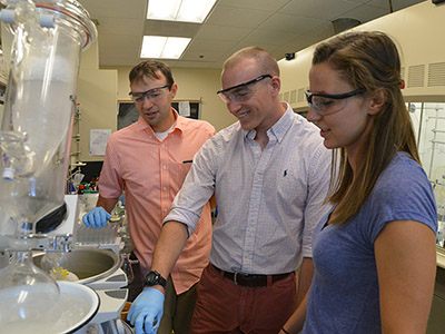 Professor and two cadets in lab