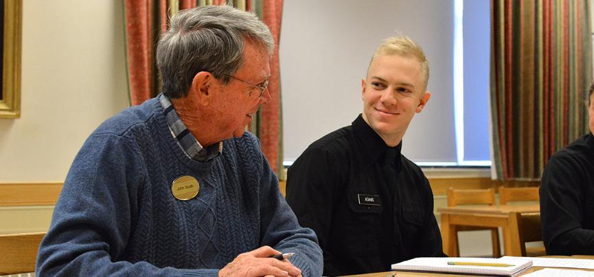 John South discusses writing with cadet Lee Adams.