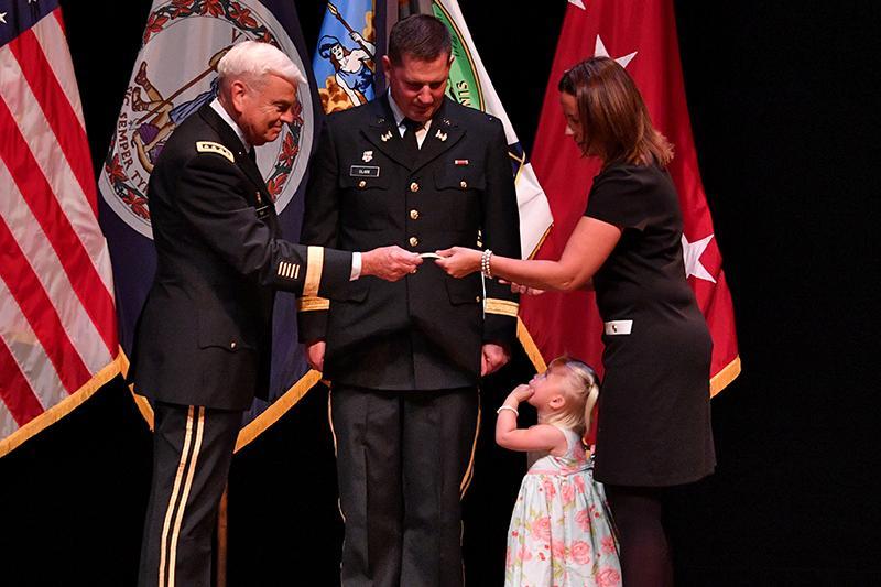 Brig. Gen. Dallas Clark receives his new rank insignia.