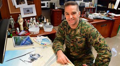 Col. Craig Streeter pauses at his office studio.