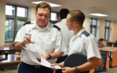Col. Howard Sanborn, professor of international studies, talks with a cadet during the study abroad fair Sept. 20.—VMI Photo by Kelly Nye.