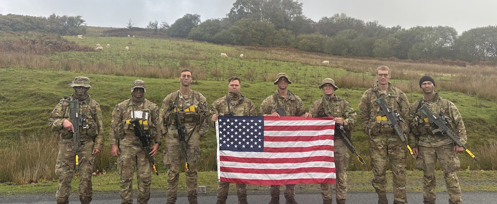 Members of the VMI Army ROTC Ranger Challenge team display their patriotism at Exercise Cambrian Patrol in the Brecon Beacons, a mountain range in Wales. --Photo courtesy of VMI Army ROTC.