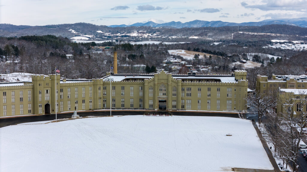 Arial view of the Barracks from over the parade grounds, with snow on the ground in winter.