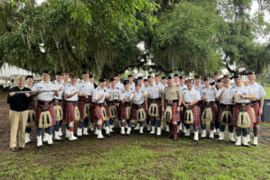 The Pipe Band poses for a group photo.