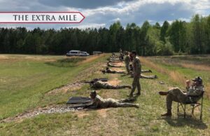 Cadets at an outdoor shooting range for practice.
