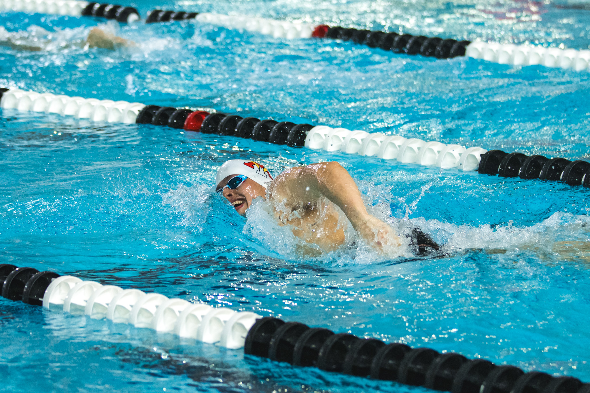 Cadet Pedro Robertson '27 swimming in the VMI Swim and Dive competition against Howard and Saint Francis.