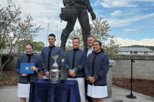 Harris Burton ’23, Riley Malone ’25, Riley Shultz ’24, Col. Patrick Looney, and Gabriele Woodward ’24 with the first-place trophy.-Photo courtesy of The Stockdale Center for Ethical Leadership, US Naval Academy
