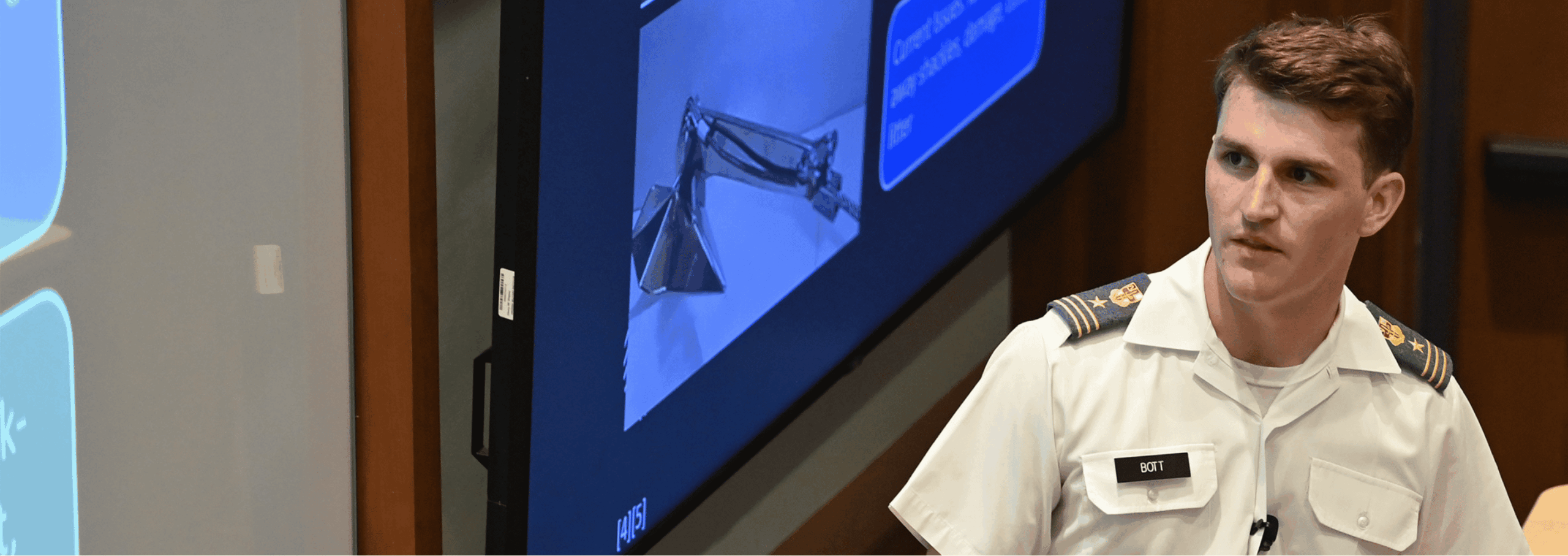 A cadet presents his research.