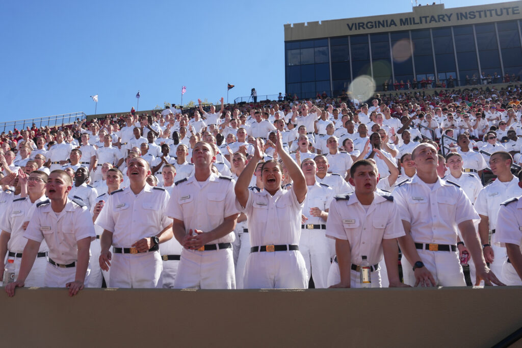 Cadets cheer in the stands of Foster Stadium.