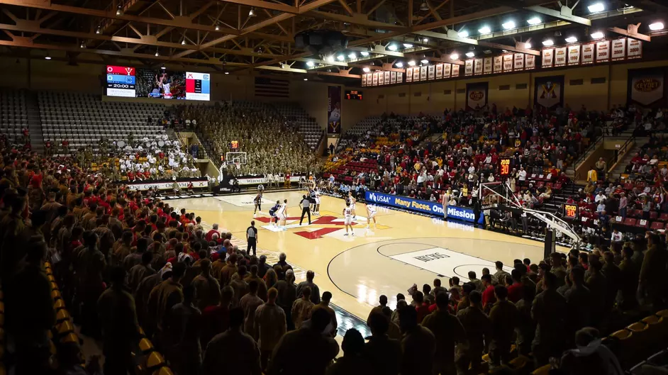 VMI basketball plays a game in Cameron Hall as the Corps of Cadets watches on.