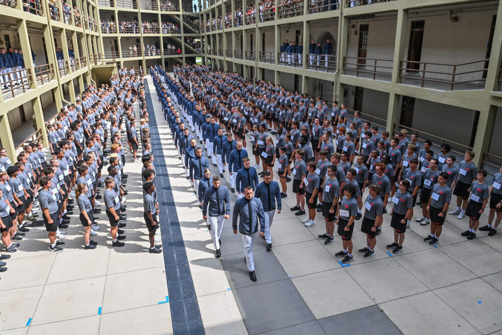 Rats stand at attention in New Barracks courtyard as their cadre slowly march in to meet them.