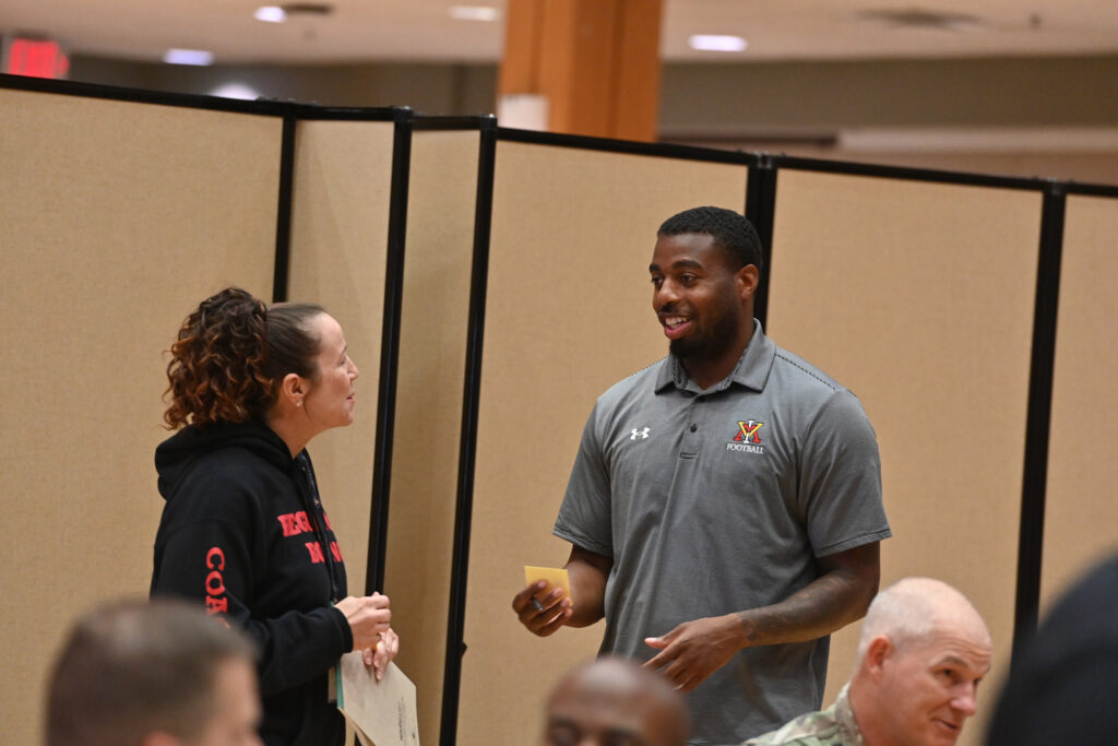 Maj. Connie Bechtel and Parrish Gaines share ideas during the group discussion session in the Hall of Valor.
