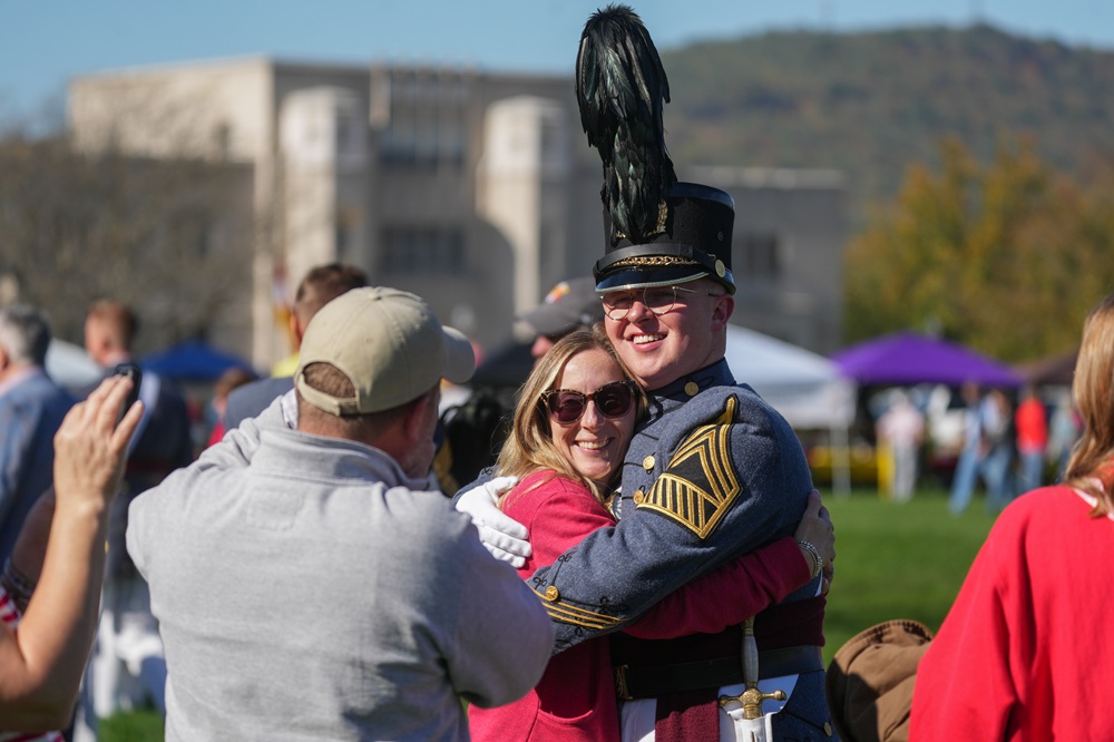 A VMI cadet hugs his mother after the parade.