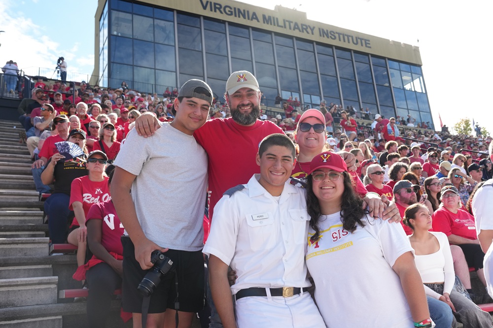 Cadets and Family members attend a football game.