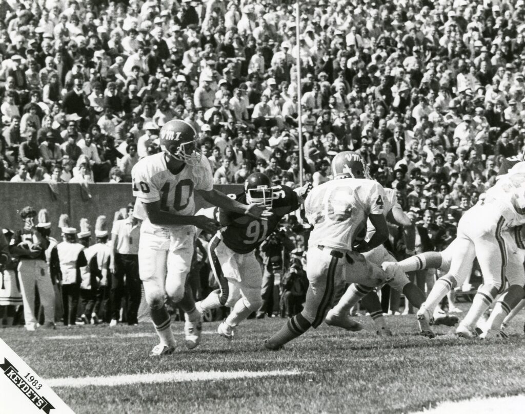 1983 VMI vs VPI football game, VMI quarterback passes the ball