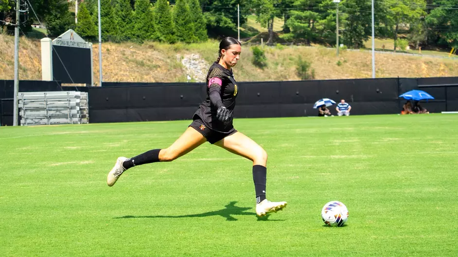 VMI soccer player lines up for a kick.