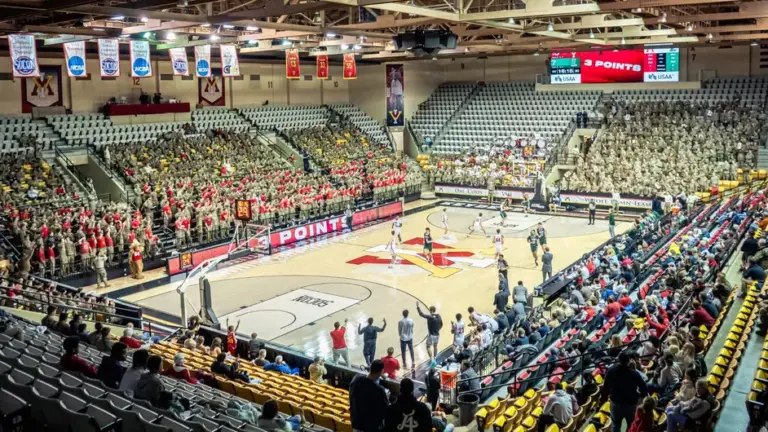 VMI basketball court with players and fans in attendance.