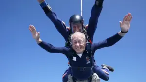 Dean Kershaw ’68 and his jumpmaster during their descent.—Photo courtesy Skydive Orange.