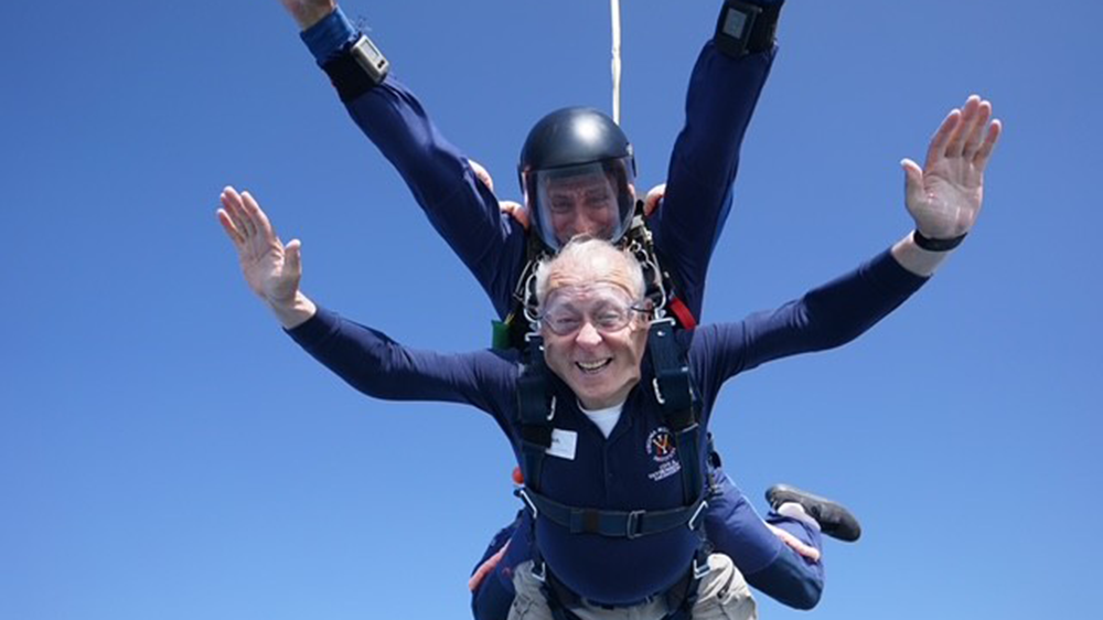 Dean Kershaw ’68 and his jumpmaster during their descent.—Photo courtesy Skydive Orange.