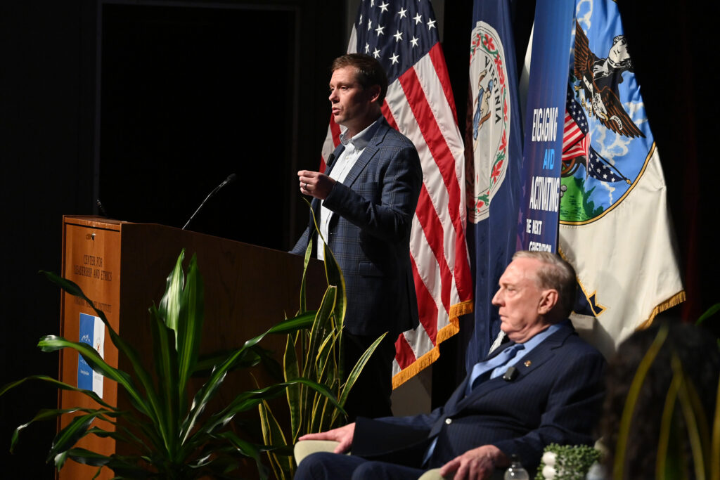 Hal Brands, Ph.D., presents his opening statement as Col. Douglas Macgregor, Ph.D., listens during the Steamboat Institute debate Oct. 1 in Gillis Theater.