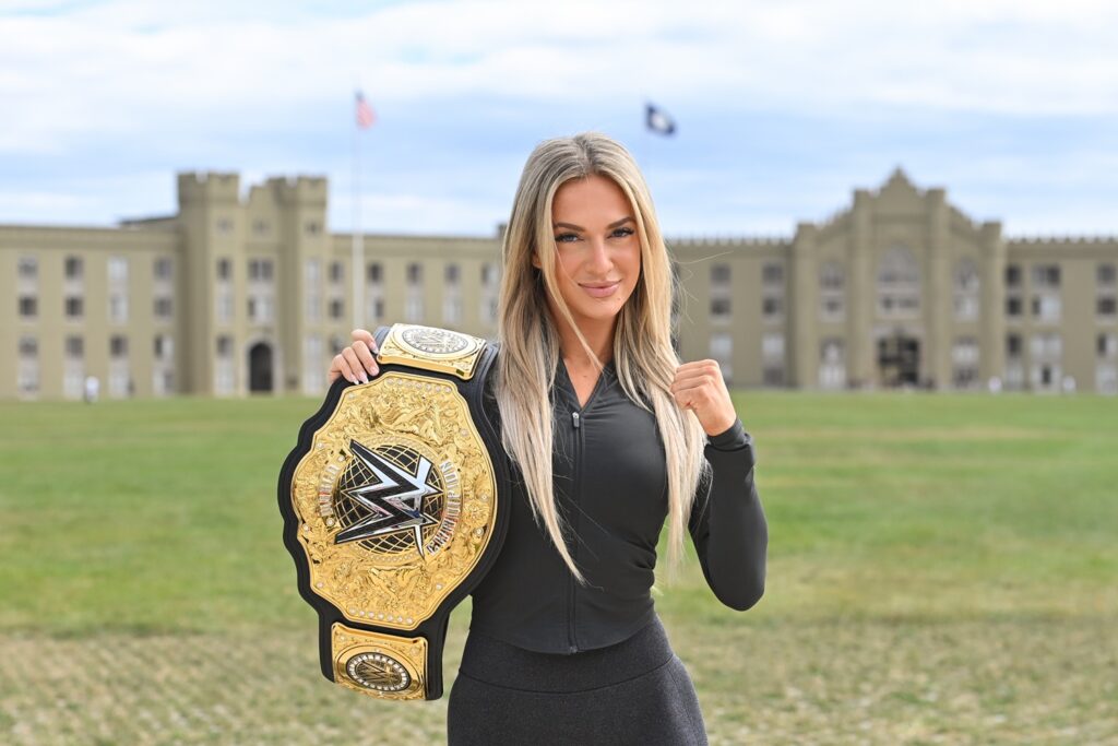 WWE Superstar Karmen Petrovic displays her championship belt in front of barracks. –VMI Photo by H. Lockwood McLaughlin.